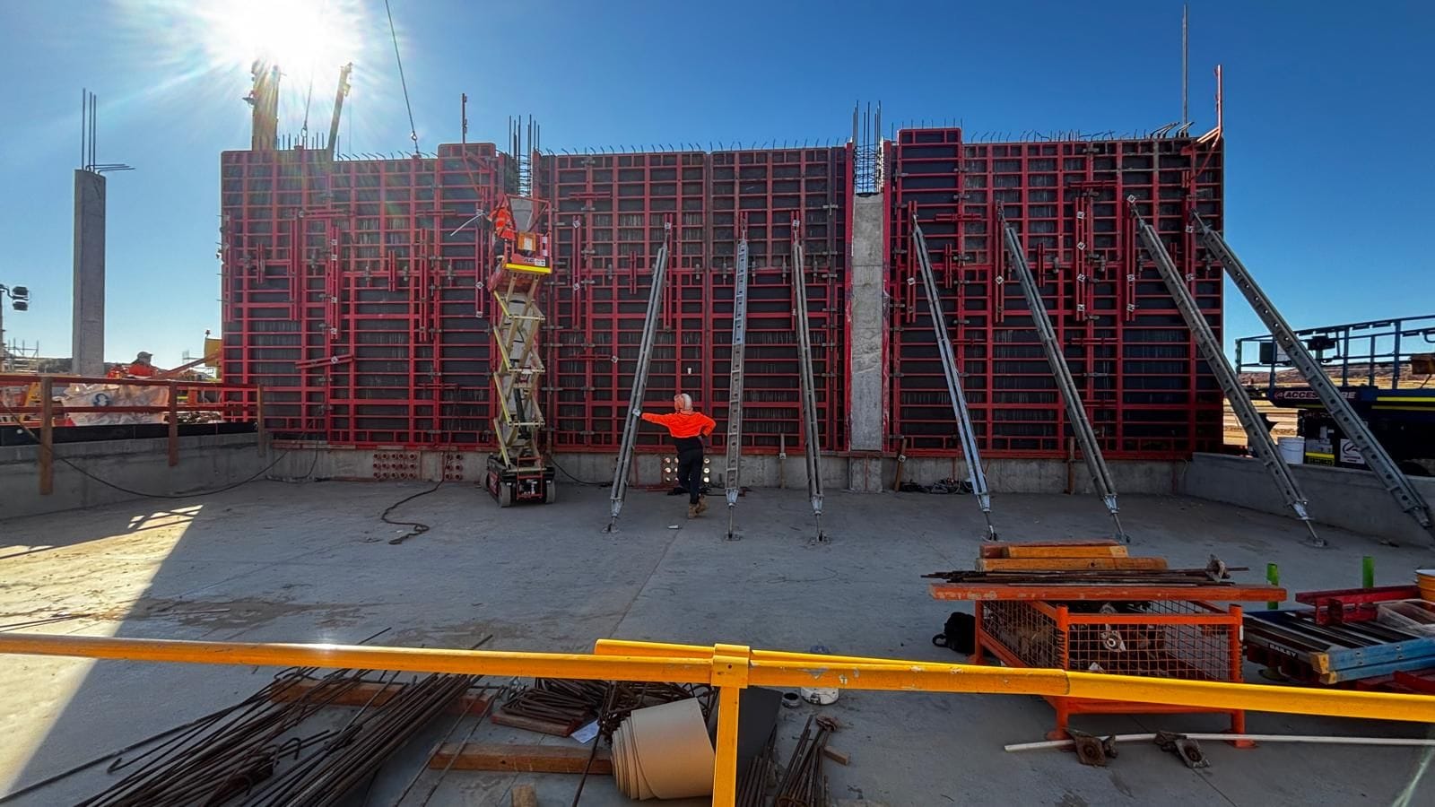 Engineered wall formwork panels and scissor lift on a major capital build